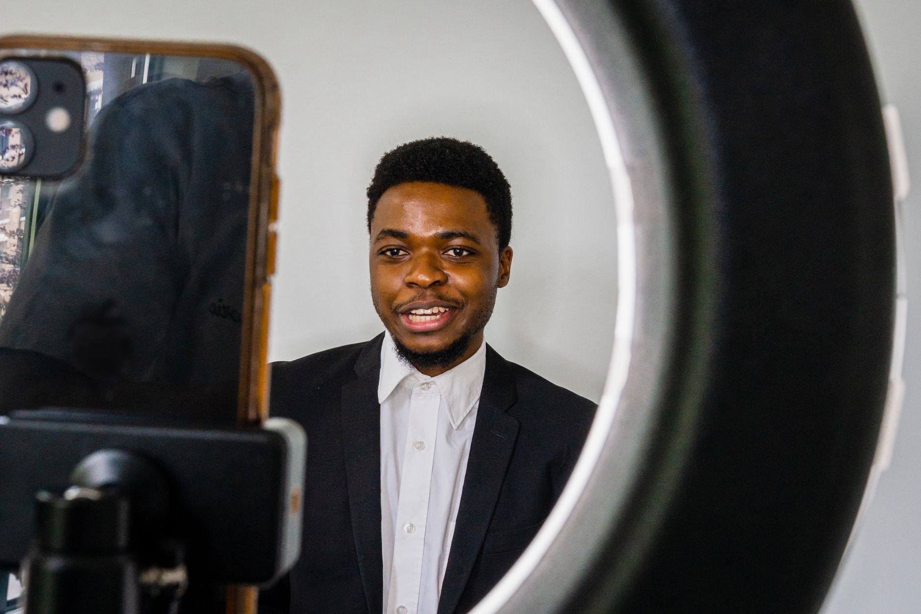 A young creator recording a product video on a smartphone